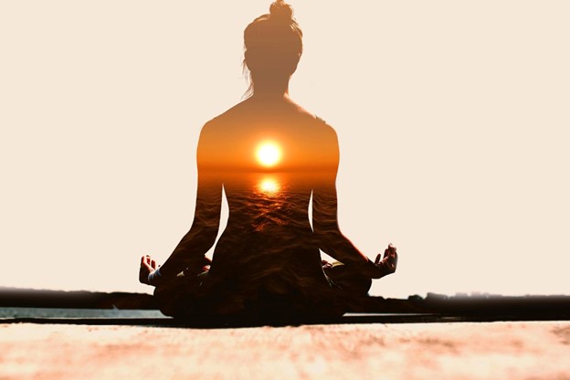 a woman practicing mediation with yoga